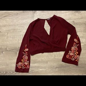 Long sleeve crop with open back.